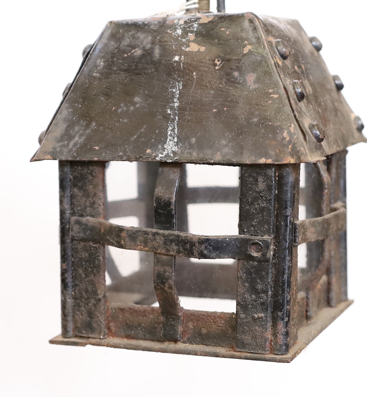 An early 20th century English wrought iron lantern with later clear glass panels, height 24cm. width 15cm